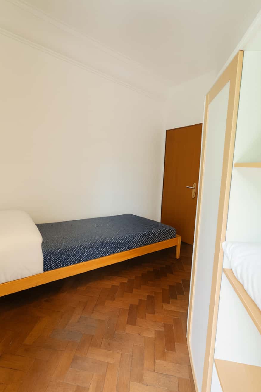 Quarto com cama de solteiro em apartamento com 7 quartos - FLAT I - I01