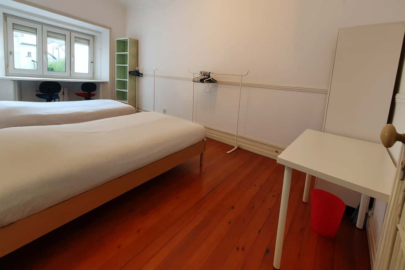 Quarto com várias camas em apartamento com 6 quartos - FLAT A - A5